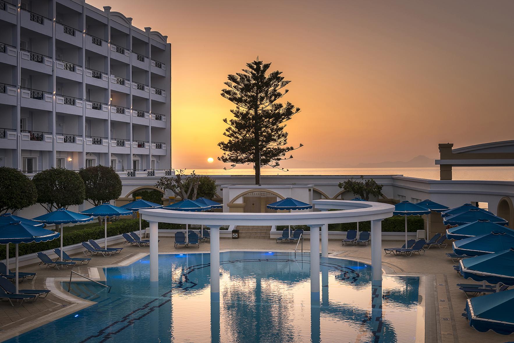 Mitsis Grand Hotel Rhodes City Екстер'єр фото Sunset at the pool